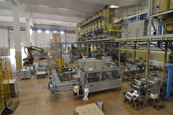 Miscela d'Oro factory interior with packaging line